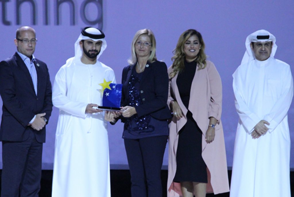 3 men and 2 women receiving award