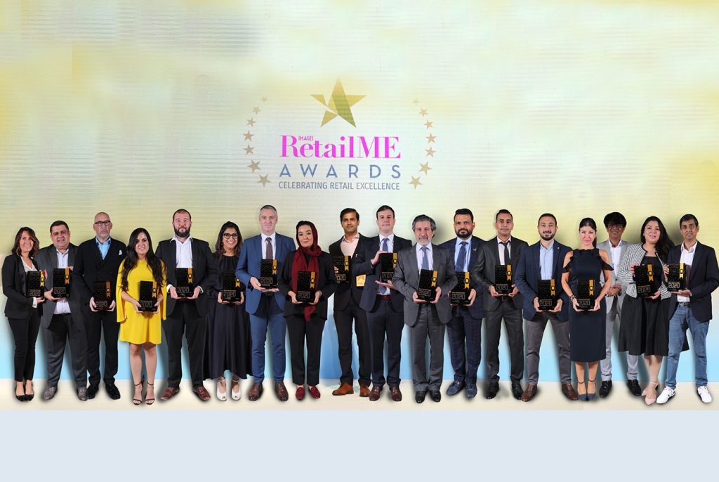 Group of awarded people holding their awards