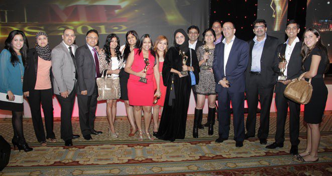 Group of men and women receiving an award