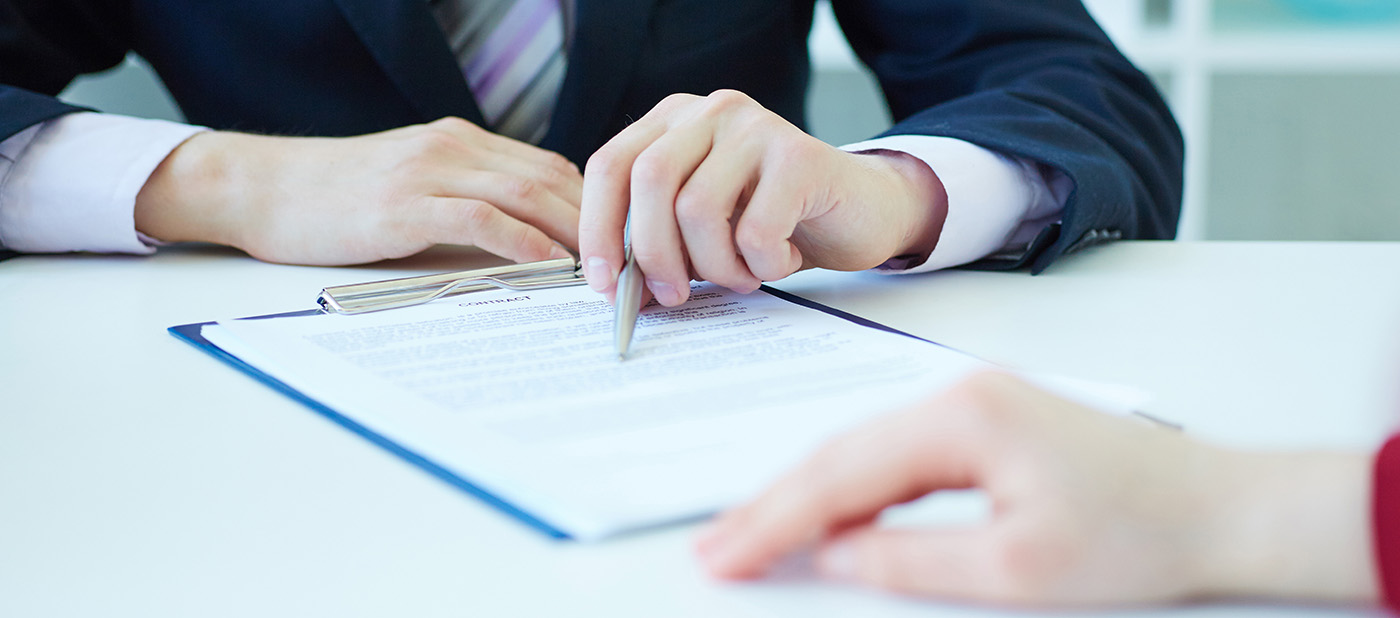 An agent presenting a contract to a client