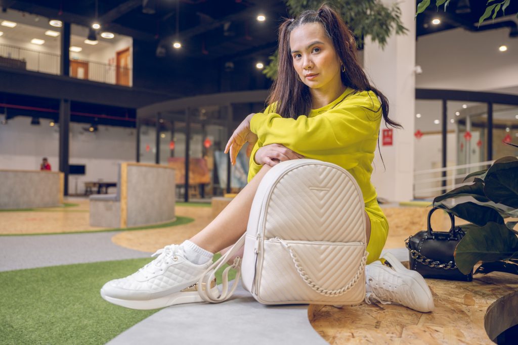 A women modelling ALDO shoes and bag