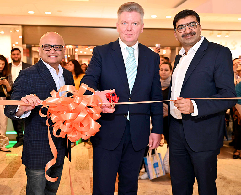 Three men opening a store