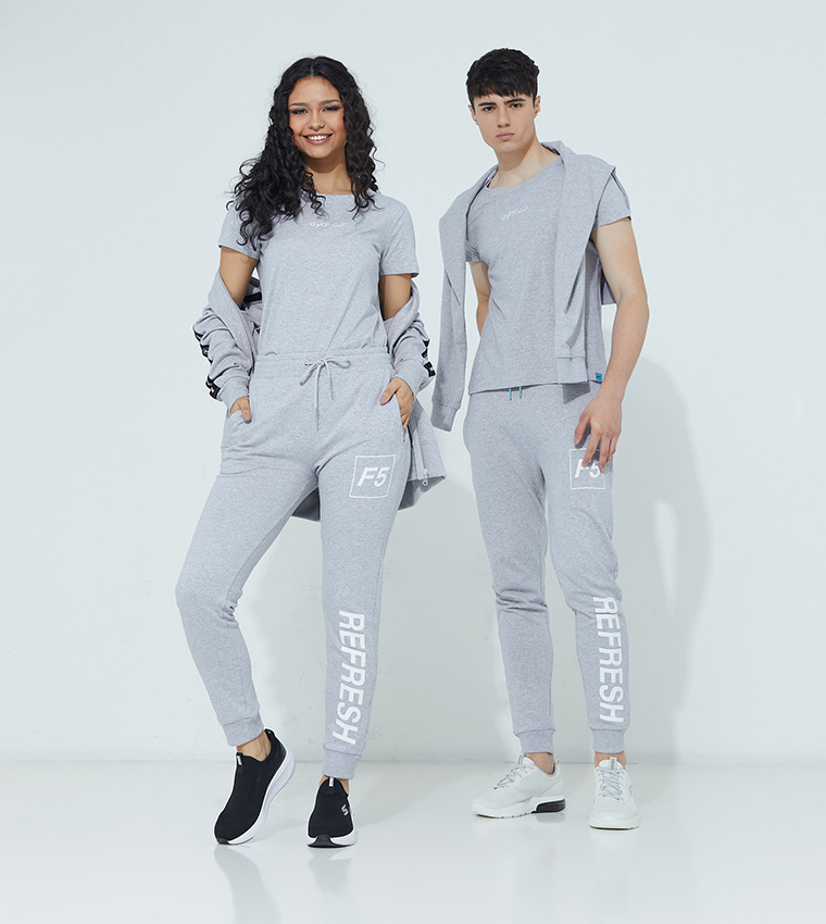 A woman and a man modelling F5 clothing