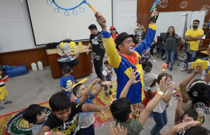 A clown playing with kids