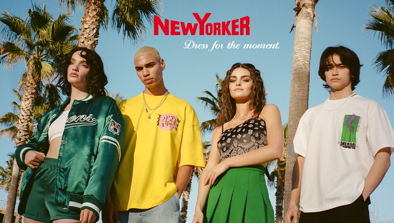 Two men and two women wearing New Yorker outfits