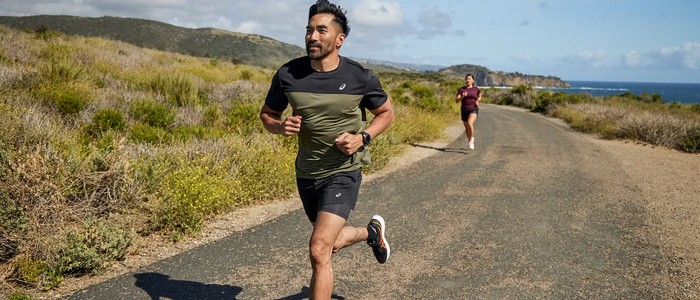 A man running, wearing ASICS fashion