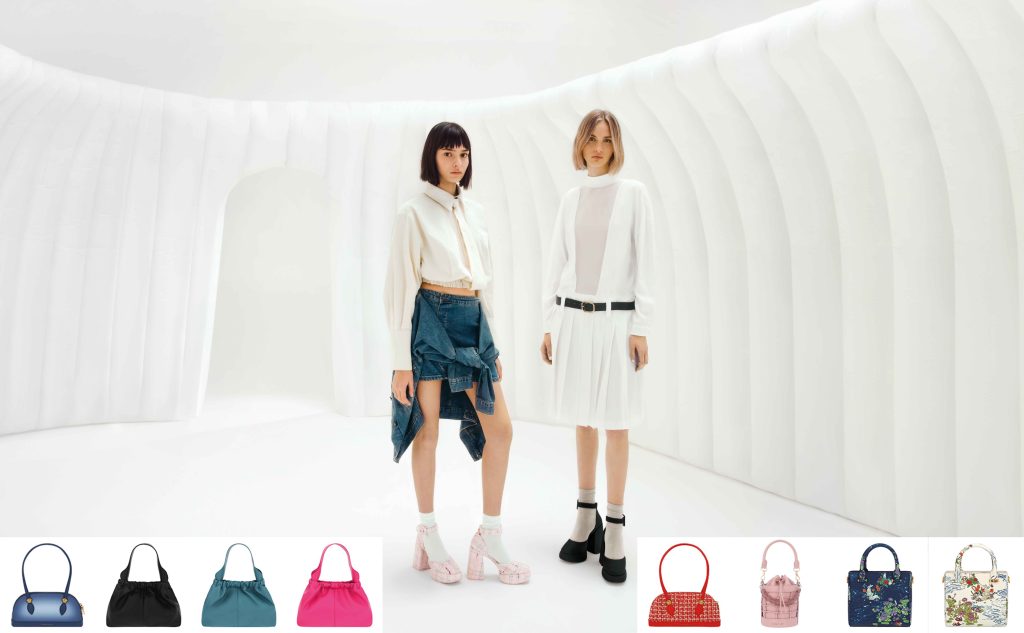 Two models modelling Charles Keith fashion with purses in the bottom