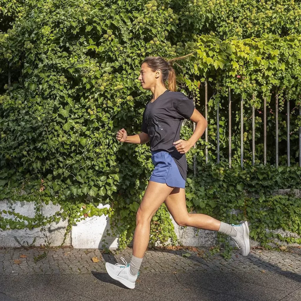 Woman running in F5 clothing