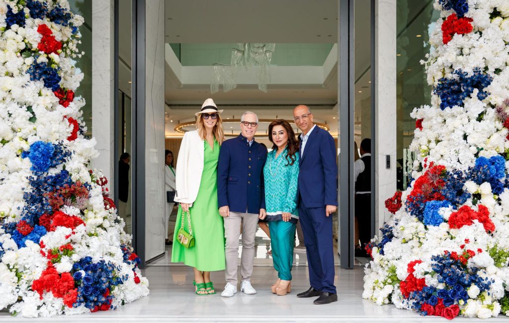 The founder of apparel group with Tommy Hilfiger celebrating successful partnership