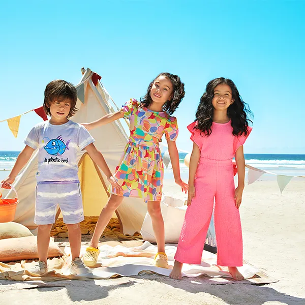 Three kids at the beach wearing R&B Clothing for Kids