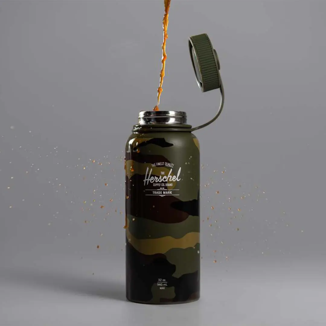 Coffee being poured into a Herschel’s Woodland Water Bottle