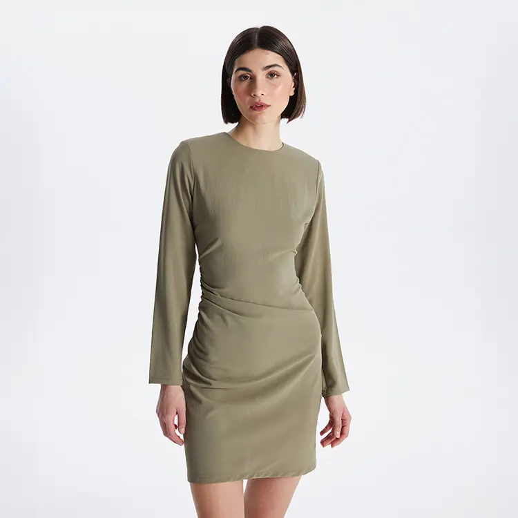 Woman in Olive Green Dress from LC Waikiki